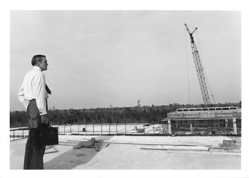 President Carpenter surveys the construction of Building 1